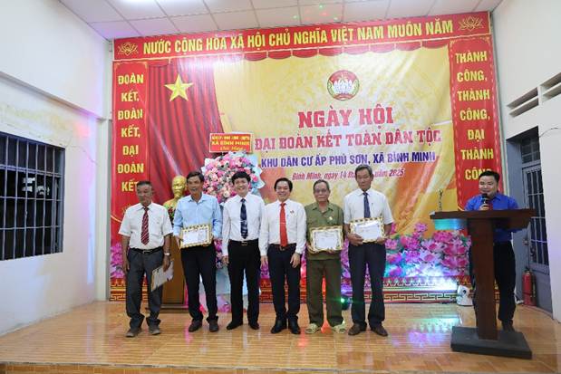 A group of men standing in front of a bannerAI-generated content may be incorrect.