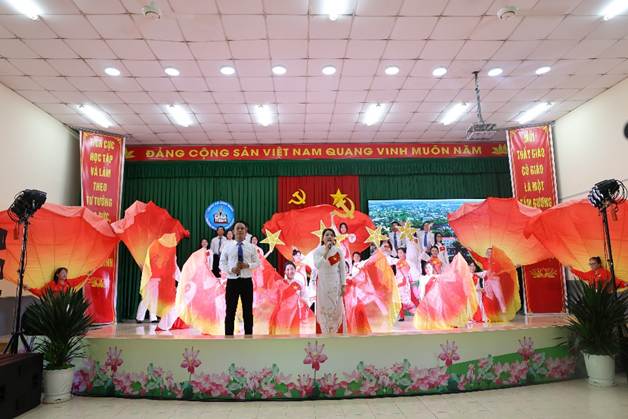 'A group of people on a stageAI-generated content may be incorrect.'