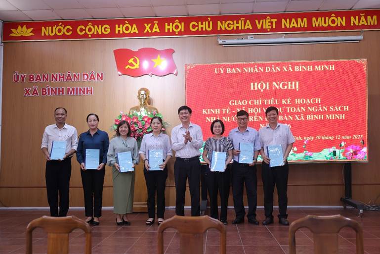 'A group of people holding papersAI-generated content may be incorrect.'